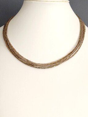 Gold seed and bugle bead multi strand necklace